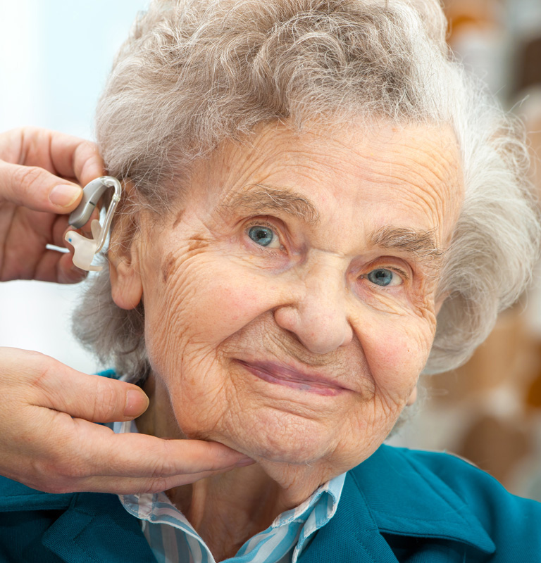 Elderly lady smiling at camera