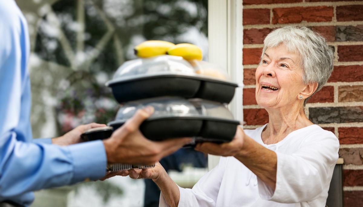 Older woman receiving meals